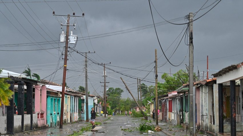 A man walks on a street during the pass of the Hurricane Rafael’s eye in Pueblo Candelaria, Artemisa Province, 65 km west of Havana, on Nov. 6, 2024. Hurricane Rafael knocked out power to all of Cuba on Wednesday as it made landfall on the island still reeling from a recent blackout and a previous major storm, the national power company said.