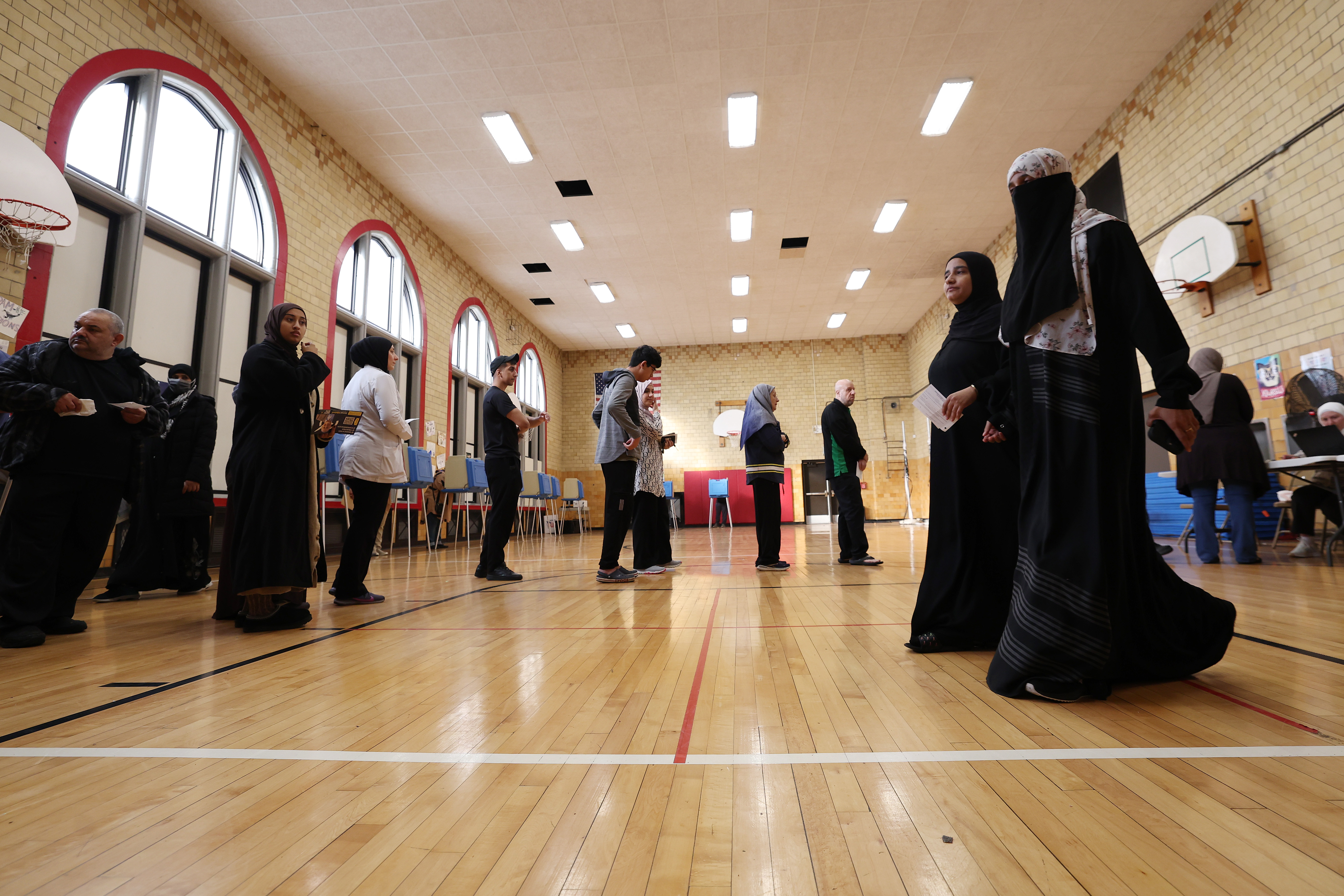 Voters wait in line to vote at the Lowrey School on November 5, 2024 in Dearborn, Michigan.