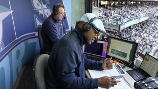 SEATTLE, WASHINGTON -OCTOBER 02: Broadcasters Mike Blowers and Dave Sims of the Seattle Mariners call a game against the Oakland Athletics at T-Mobile Park on October 2, 2022 in Seattle, Washington.