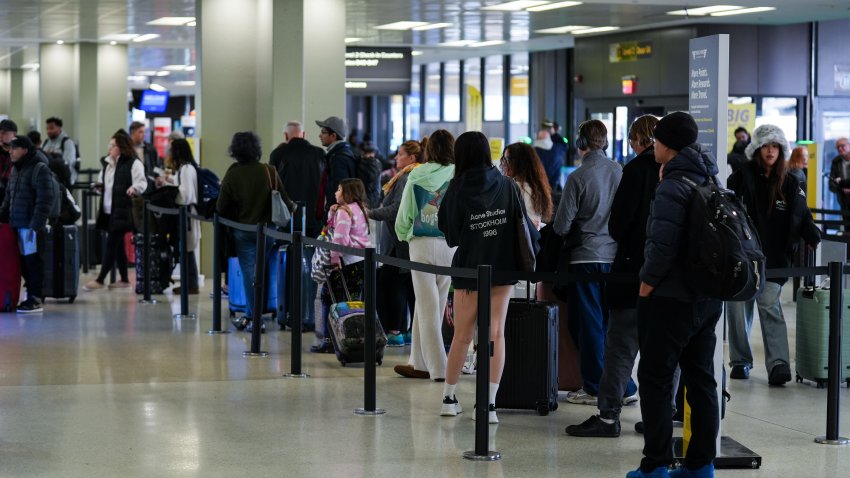 NEAWARK, UNITED STATES – NOVEMBER 26: Travelers are seen at the Newark Liberty International Airport (EWR) ahead of Thanksgiving holiday, in New Jersey, United States on November 26, 2024. A record 80 million Americans are expected to hit the road or fly more than 50 miles between Tuesday and the Monday after Thanksgiving, a 2.1% increase from 2023. (Photo by Lokman Vural Elibol/Anadolu via Getty Images)