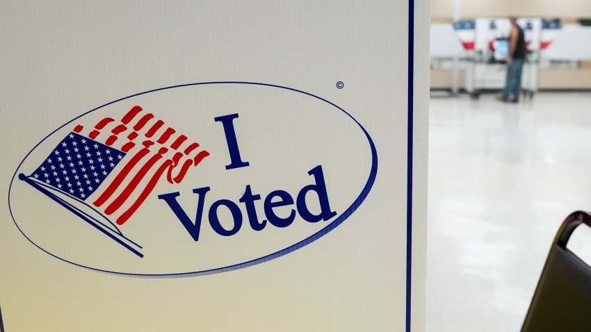 An â€œI Votedâ€ sign is seen as a voter fills out his ballot at a booth within the polling site at Baker Community Center in Millington, Tenn., on Thursday, August 1, 2024.