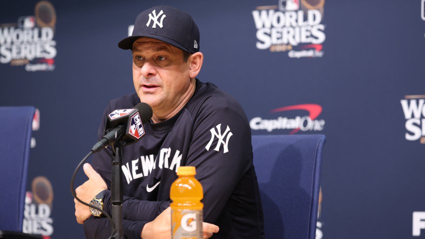 Oct 25, 2024; Los Angeles, California, USA; New York Yankees manager Aaron Boone (17) talks with the media before the game against the Los Angeles Dodgers during game one of the 2024 MLB World Series at Dodger Stadium. Mandatory Credit:  Kiyoshi Mio-Imagn Images