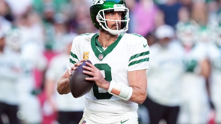 Nov 10, 2024; Glendale, Arizona, USA; New York Jets quarterback Aaron Rodgers (8) passes against the Arizona Cardinals during the second half at State Farm Stadium. Mandatory Credit: Joe Camporeale-Imagn Images