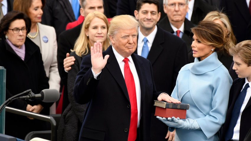 Jan 20, 2017; Washington, DC, USA; Donald Trump takes the oath of office during the 2017 Presidential Inauguration at the U.S. Capitol. Mandatory Credit: Robert Hanashiro-USA TODAY