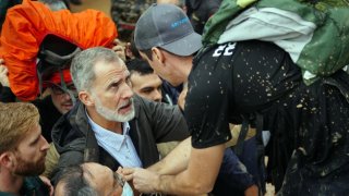 King Felipe is heckled as he tours flood damage.