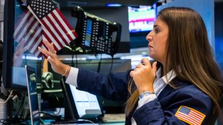 Traders work on the floor of the New York Stock Exchange.