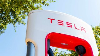 Tesla Supercharger stations are seen in a parking lot in Austin, Texas, on Sept. 16, 2024.