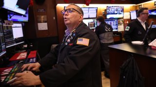 Traders work on the floor of the New York Stock Exchange during morning trading on November 26, 2024 in New York City.