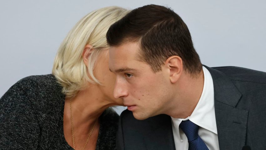 President of Rassemblement National parliamentary group Marine Le Pen (L) speaks to French far-right Rassemblement National (National Rally) RN party’s President and lead MEP Jordan Bardella during the French far-right Rassemblement National (National Rally) RN party’s parliamentary seminar at the French National Assembly in Paris on September 14, 2024. 