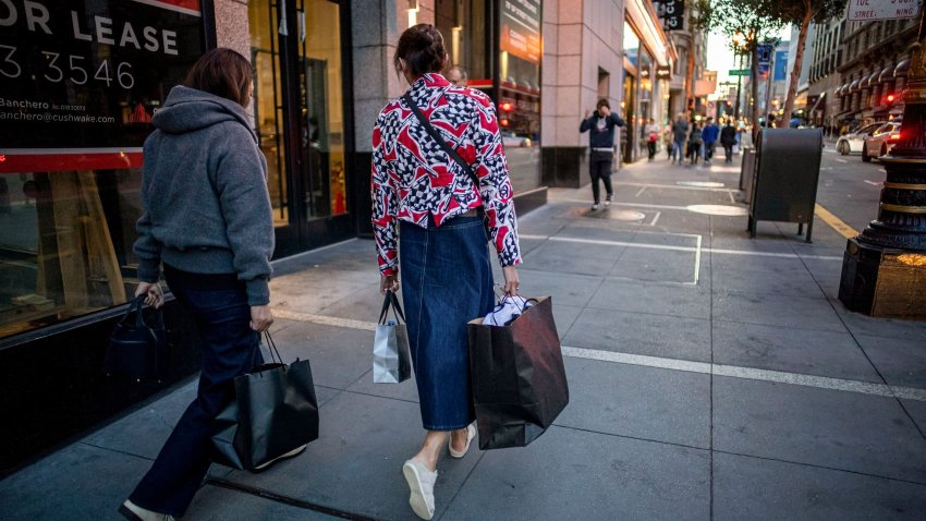 Shoppers carry bags in the Union Square area of San Francisco, California, US, on Thursday, Dec. 5, 2024. 