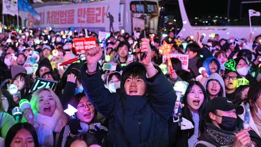 Protesters calling for the ouster of South Korea President Yoon Suk Yeol reacting after the result of the second martial law impeachment vote outside the National Assembly in Seoul on Dec. 14, 2024.