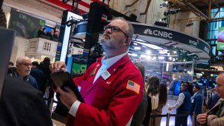 Traders work on the New York Stock Exchange (NYSE) floor in New York City. 