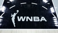 A WNBA logo is shown on the court