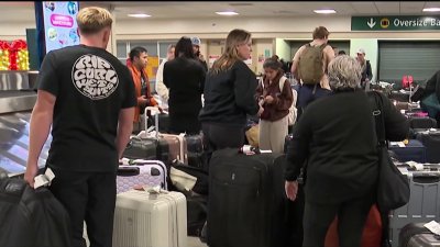 Holiday travelers experiencing delays at San Diego International Airport