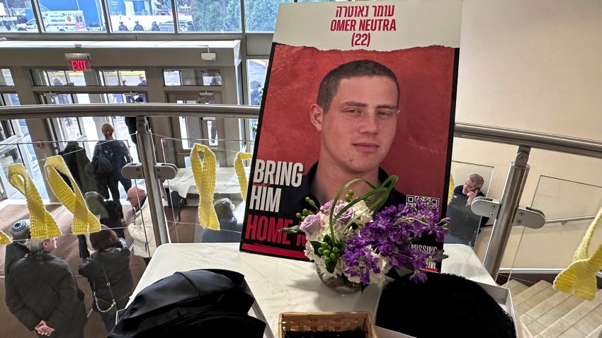 An image of Omer Neutra is displayed at his memorial service Tuesday, Dec. 3, 2024 at the Midway Jewish Center in Syosset, N.Y.