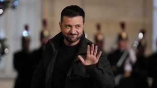 Ukraine’s President Volodymyr Zelenskyy waves as he arrives at the Elysee Palace, Saturday, Dec. 7, 2024 in Paris.