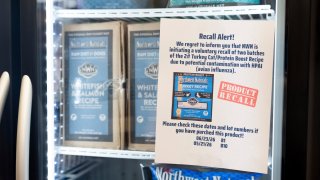 A recall alert is displayed on a refrigerator at a pet store after Northwest Naturals issued a voluntary recall on two batches of their 2-pound Feline Turkey Recipe raw frozen pet food on Thursday, Dec. 26, 2024, in Tigard, Ore.