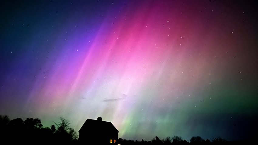 FILE – The northern lights flare in the sky over a farmhouse, May 10, 2024, in Brunswick, Maine. (AP Photo/Robert F. Bukaty, File)