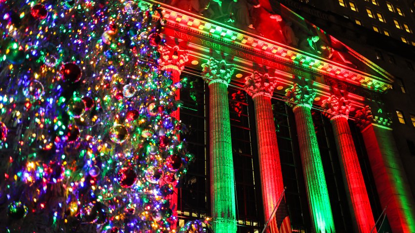 A Christmas tree is displayed on the outside the New York Stock Exchange (NYSE) on December 16, 2024, in New York City. (Photo by CHARLY TRIBALLEAU / AFP) (Photo by CHARLY TRIBALLEAU/AFP via Getty Images)