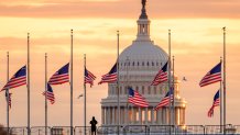 WASHINGTON, DC - DECEMBER 30: U.S. flags on the National Mall fly at half-staff at daybreak with the U.S. Capitol in the background in honor of the passing of former U.S. President Jimmy Carter on December 30, 2024, in Washington, DC. (Photo by J. David Ake/Getty Images)