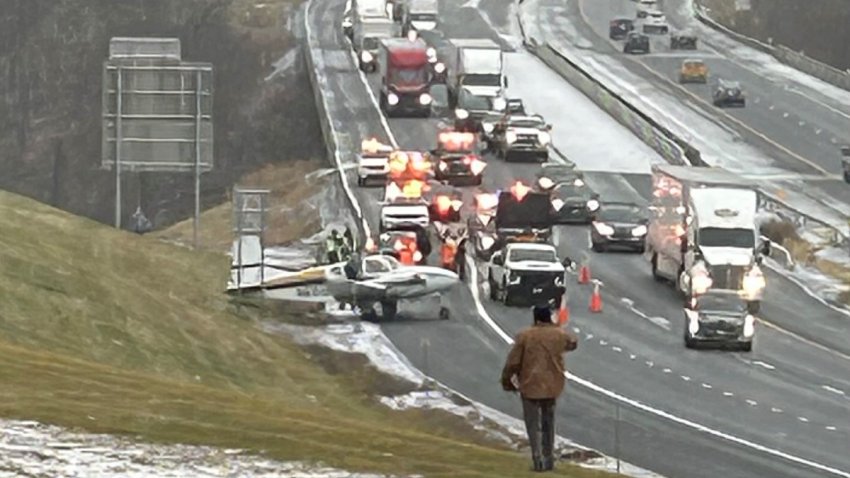 plane lands on thruway