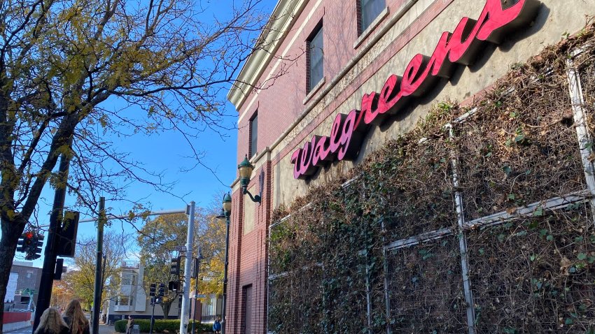 People walk by a Walgreens on Nov. 3, 2024 in Brookline, Massachusetts.