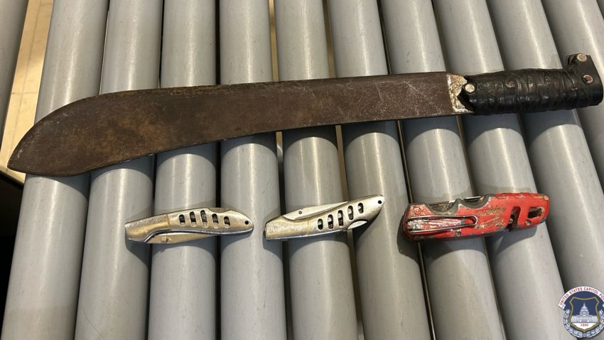 A machete and three knives that U.S. Capitol Police say were confiscated from a man who was arrested at a Capitol screening checkpoint as former President Jimmy Carter lay in state in the Capitol Rotunda, Jan. 8, 2025.