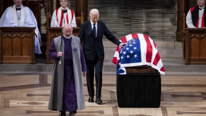 US President Joe Biden touches the casket after delivering the eulogy at the State Funeral Service for former US President Jimmy Carter at the Washington National Cathedral in Washington, DC, on January 9, 2025. 