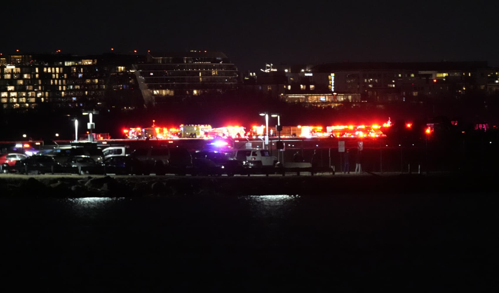 Aircraft crashes close to Reagan Nationwide Airport after mid-air collision with navy helicopter, officers say Aircraft crashes close to Reagan Nationwide Airport after mid-air collision with navy helicopter, officers say