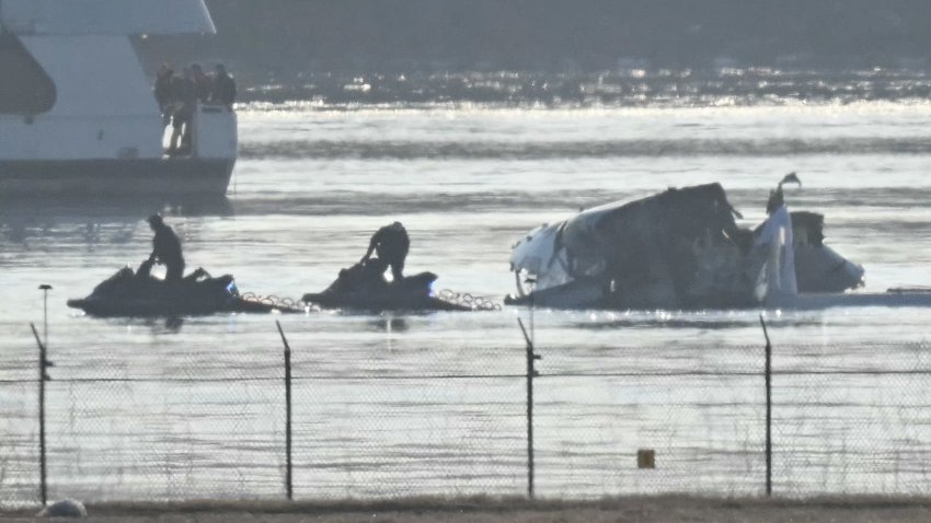 Part of the wreckage is seen as rescue crews search the waters of the Potomac River after a passenger plane on approach to Reagan National Airport crashed into the river after colliding with a US Army helicopter, near Washington, DC, on January 30, 2025. 