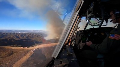 Watch from the cockpit as the National Guard drops fire retardant on Palisades Fire