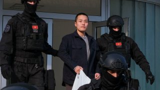 FILE – Montenegrin police officers escort South Korean citizen, Terraform Labs founder Do Kwon in Montenegro’s capital Podgorica, Saturday, March 23, 2024.  (AP Photo/Risto Bozovic, File)