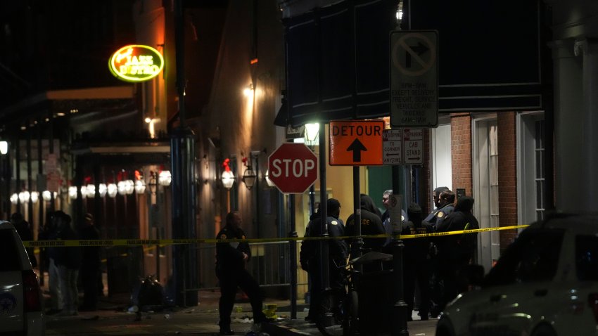 Emergency services attend the scene after a vehicle drove into a crowd on New Orleans' Canal and Bourbon Street, Wednesday Jan. 1, 2025.