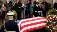 Guests pay their respects as the flag-draped casket of former President Jimmy Carter lies in state at the U.S. Capitol, Wednesday, Jan. 8, 2025, in Washington. Carter died Dec. 29 at the age of 100.