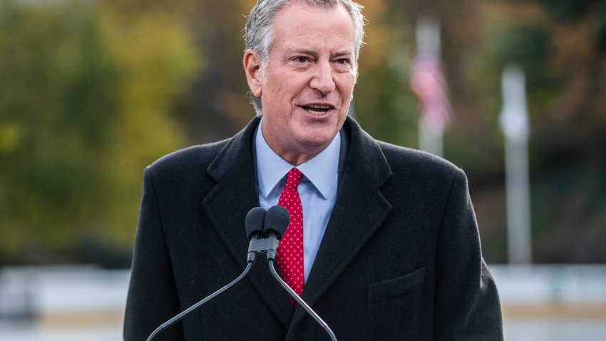 FILE – New York City Mayor Bill de Blasio speaks at the opening of New York’s Wollman Rink in Central Park, Nov. 14, 2021. (AP Photo/Brittainy Newman, File)