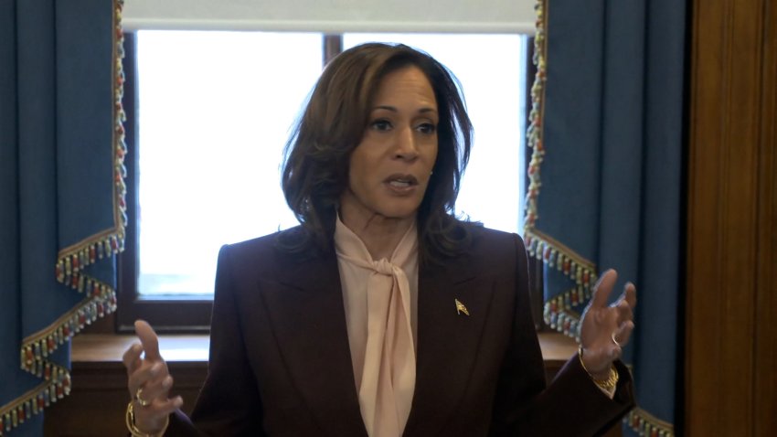 Kamala Harris speaking to reporters.