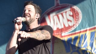 MOUNTAIN VIEW, CALIFORNIA – JULY 20: Pierre Bouvier of Simple Plan performs during the Vans Warped Tour 25th Anniversary on July 20, 2019 in Mountain View, California.