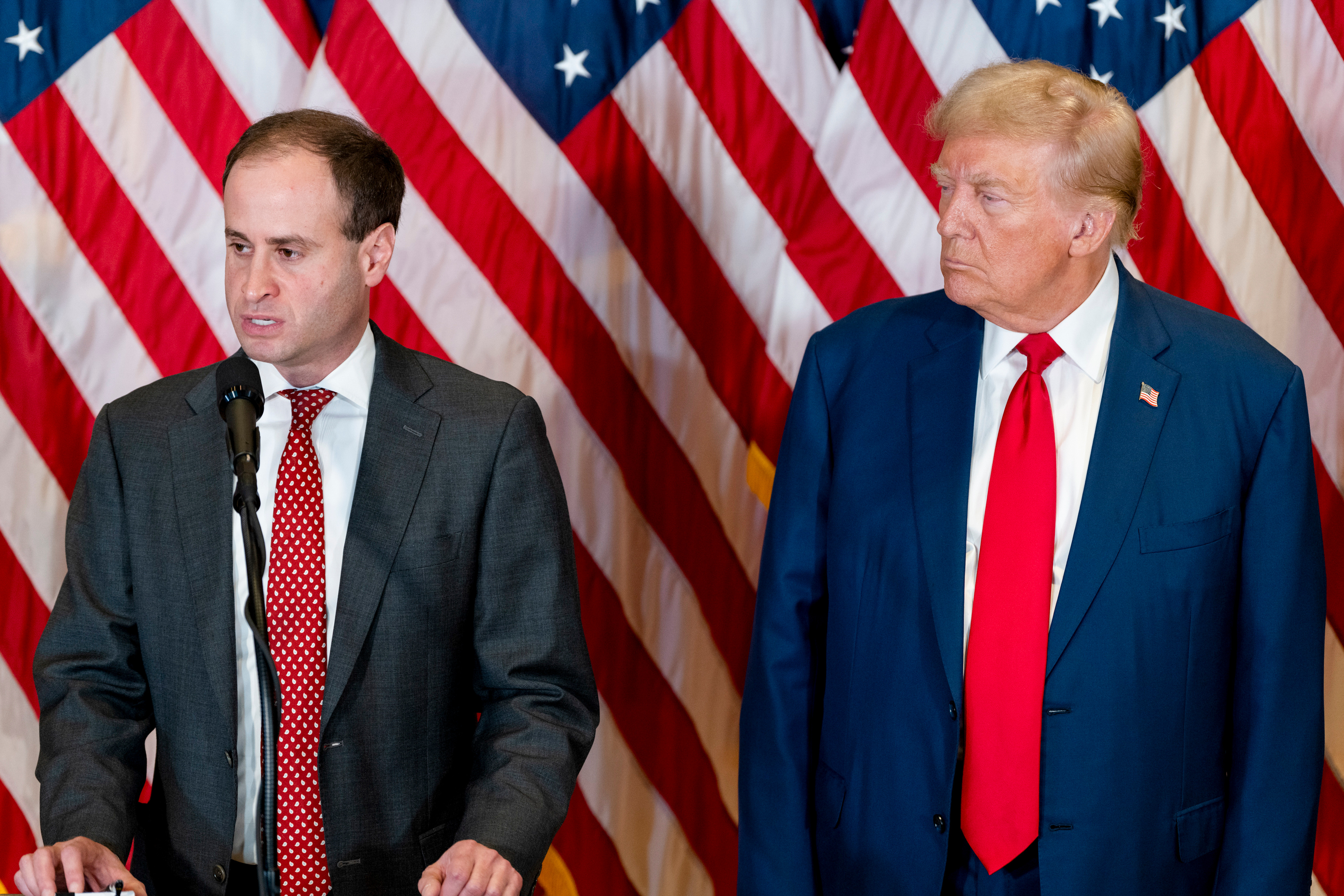 Who’s the man handing Trump these binders of government orders? Meet Will Scharf