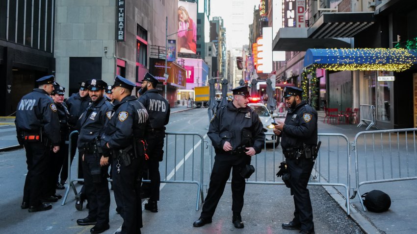 New York City Police Department (NYPD) officers stand watch in Times Square in New York City ahead of the New Year’s Eve celebration on December 31, 2024. (Photo by CHARLY TRIBALLEAU / AFP) (Photo by CHARLY TRIBALLEAU/AFP via Getty Images)