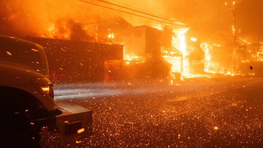 Embers fly in high winds as firefighters battle winds and flames as multiple beachfront homes go up in flames in the Palisades Fire.