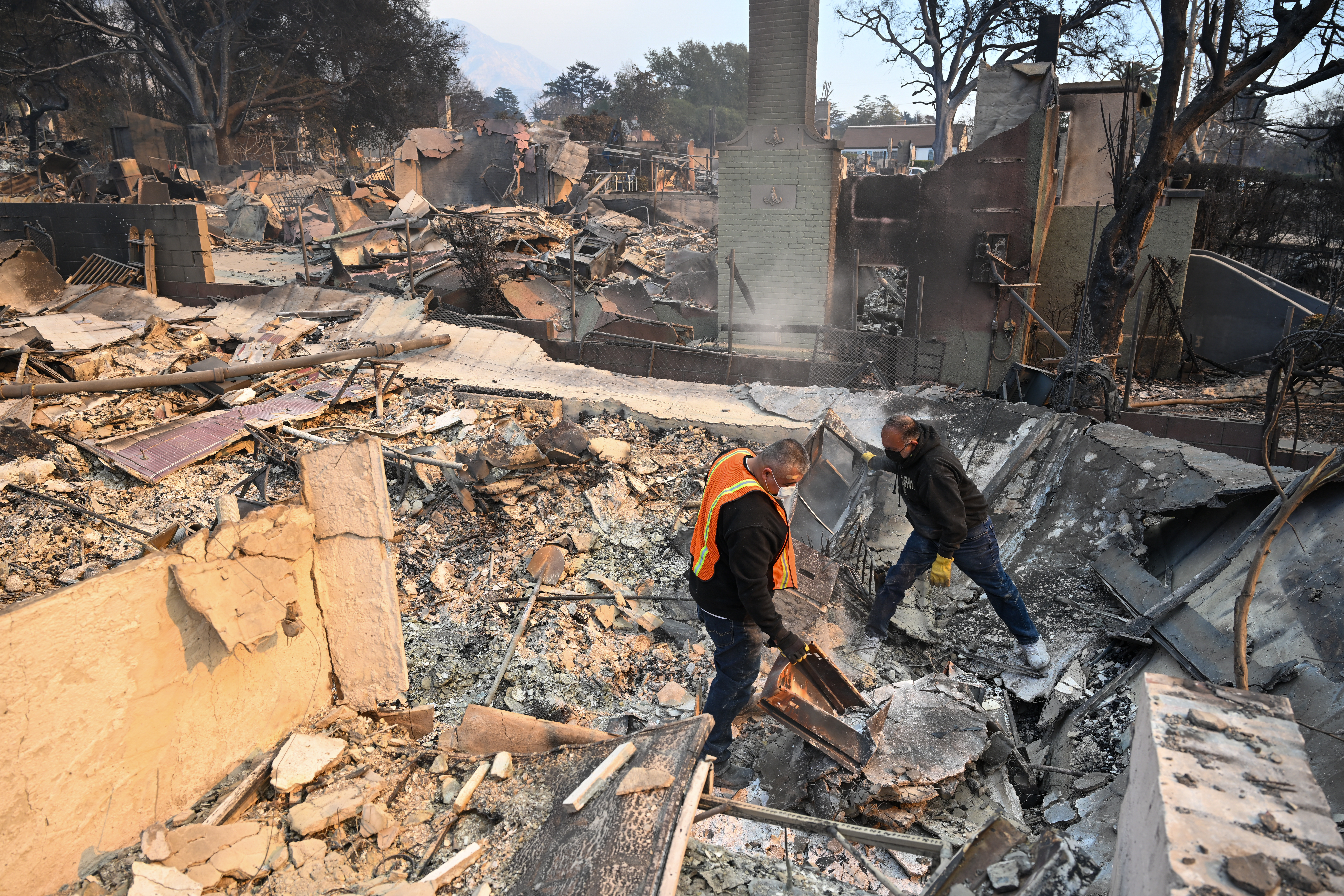 Residents search for valuables among the rubbles of their burnt houses in Altadena of Los Angeles County, California, United States on January 9, 2025.