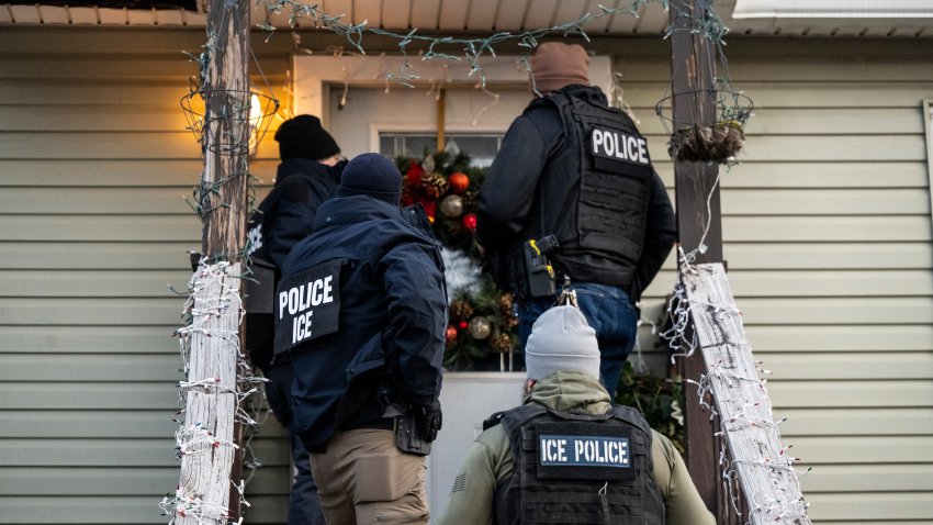 US Immigration and Customs Enforcement (ICE) agents knock on the door of a residence during a multi-agency targeted enforcement operation in Chicago, Illinois, US, on Sunday, Jan. 26, 2025. President Donald Trump has pledged to carry out the largest deportation effort in US history, vowing to ultimately deport all of the foreigners living in the country without permission.