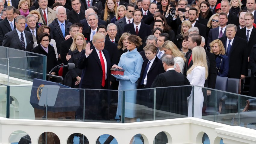 WASHINGTON, DC – JANUARY 20:  Supreme Court Justice John Roberts (R) administers the oath of office to U.S. President Donald Trump (L) as his wife Melania Trump holds the Bible on the West Front of the U.S. Capitol on January 20, 2017 in Washington, DC. In today’s inauguration ceremony Donald J. Trump becomes the 45th president of the United States.  (Photo by Chip Somodevilla/Getty Images)