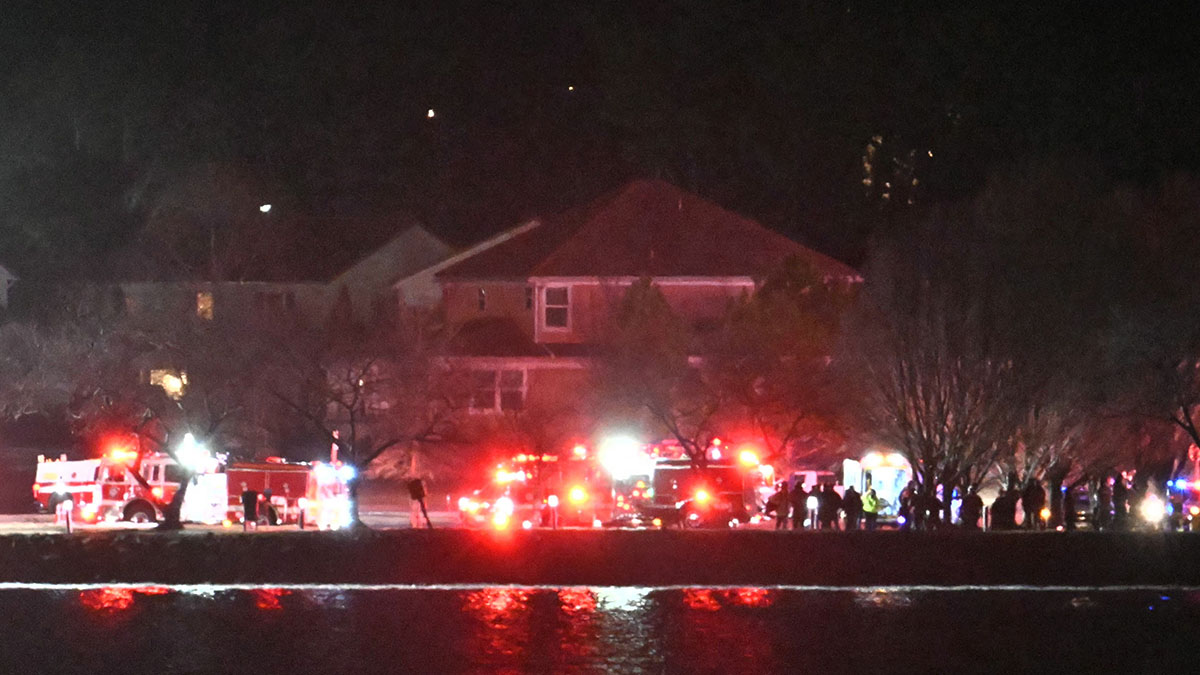 Lights from emergency vehicles are seen as rescue crews gather along the Potomac River near Reagan National Airport in Washington, D.C., after an air crash. A passenger jet from Kansas crashed into Washington’s Potomac River after colliding mid-air with a military helicopter near Reagan National Airport, officials said Wednesday, prompting a major emergency response and grounding all flights. (Photo by ANDREW CABALLERO-REYNOLDS/AFP via Getty Images)