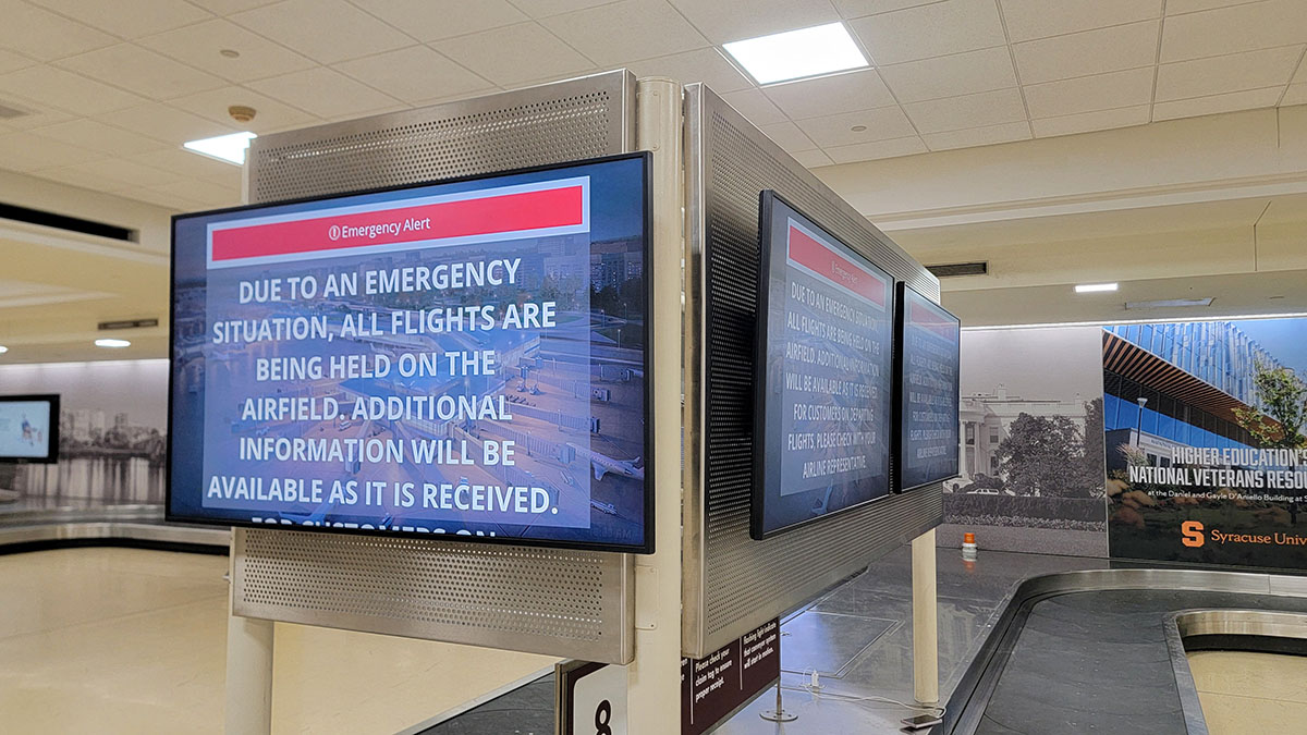 An information screen in Reagan National Airport’s empty baggage claim area displays emergency instructions after a plane crashed into the Potomac River outside Washington, D.C. (Photo: ULYSSE BELLIER/AFP via Getty Images)