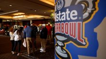 Jan 1, 2025; New Orleans, LA, USA;  Fans line at the front desk of the Sheraton hotel after the Sugar Bowl CFP quarterfinal between Georgia and Notre Dame was postponed after an attack on Bourbon Street. Mandatory Credit: Geoff Burke-Imagn Images