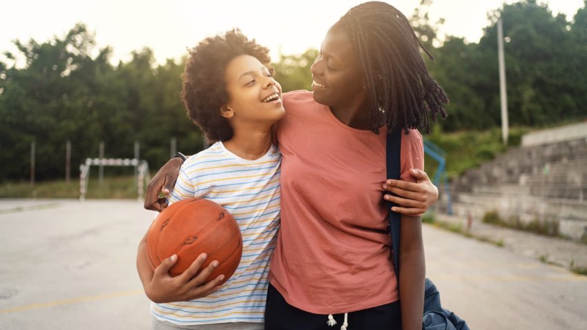 mother picking up her teenage daughter from her basketball practise