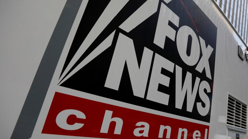 FILE PHOTO: A Fox News channel sign is seen on a television vehicle outside the News Corporation building in New York City, in New York.