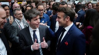 Sam Altman, CEO of OpenAI, speaks with French President Emmanuel Macron at Station F, during an event on the sidelines of the Artificial Intelligence Action Summit in Paris, France, Feb. 11, 2025.