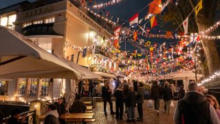 A general view of people visiting the Trafalgar Tavern pub decorated with bunting and string lights on the bank of the River Thames in Greenwich on December 16, 2023 in London, United Kingdom.